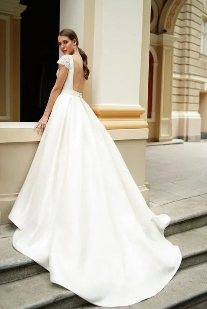 Simple Satin A-Line Wedding Dress Jewel Neck Short Capped Sleeves Backless with Ruched Sash Sweep Train Modern Beach Style