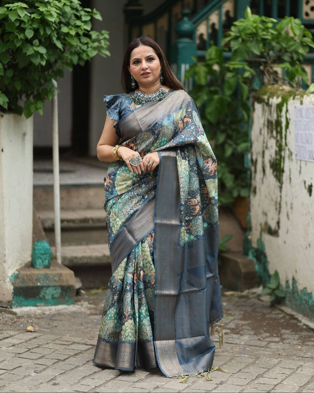 Elegant Teal Blue Banarasi Silk Saree with Forest-Inspired Motifs and