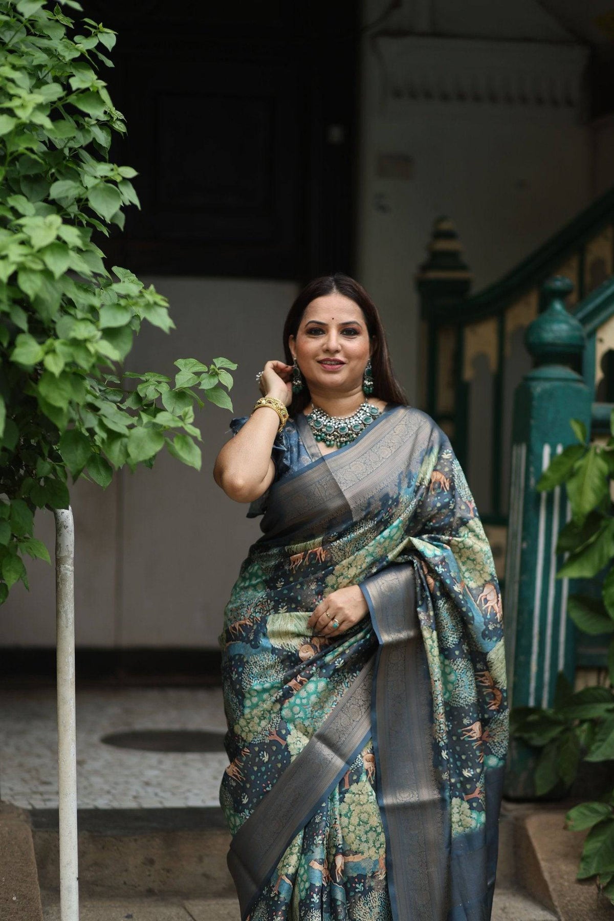 Elegant Teal Blue Banarasi Silk Saree with Forest-Inspired Motifs and