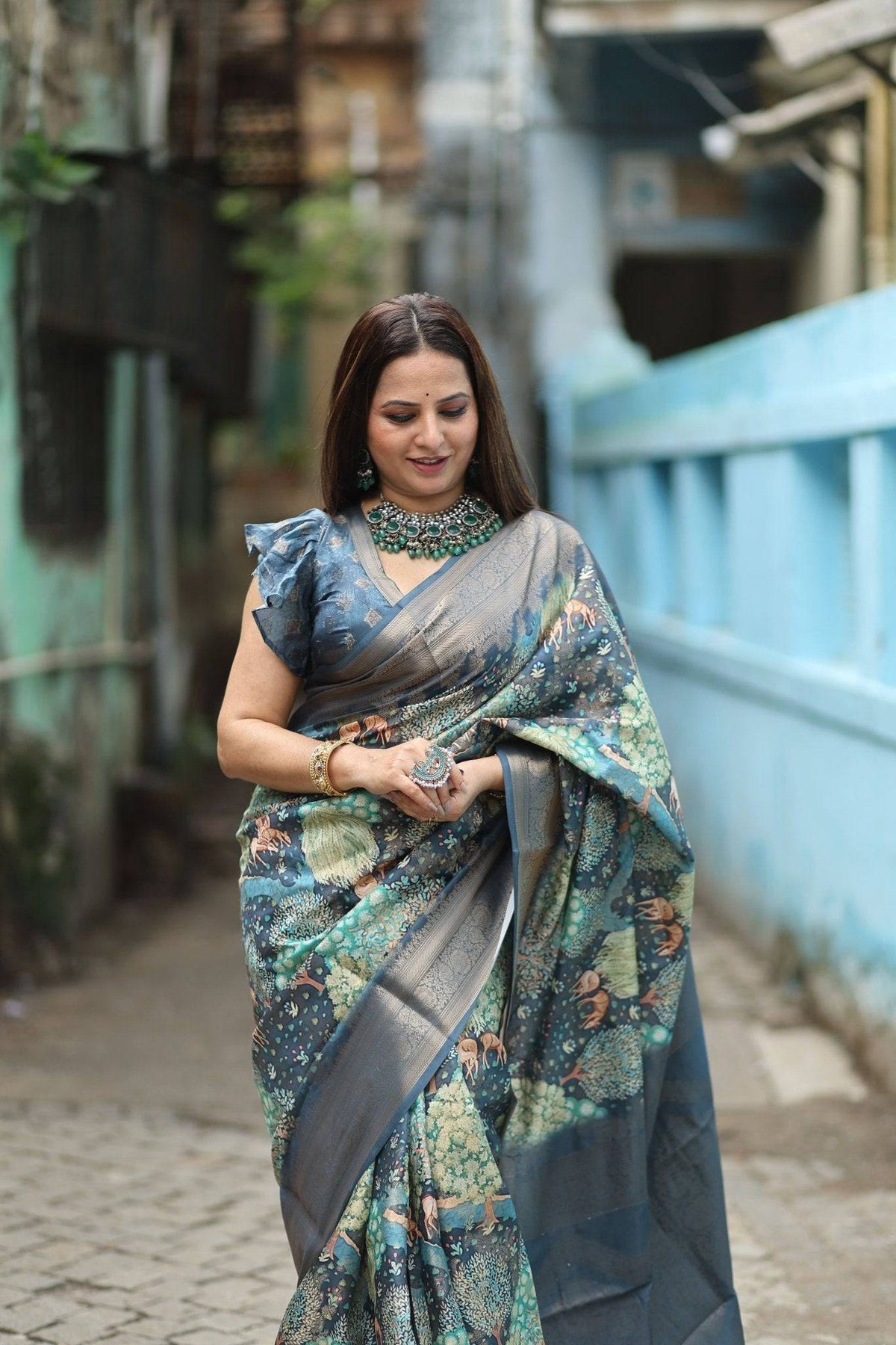 Elegant Teal Blue Banarasi Silk Saree with Forest-Inspired Motifs and