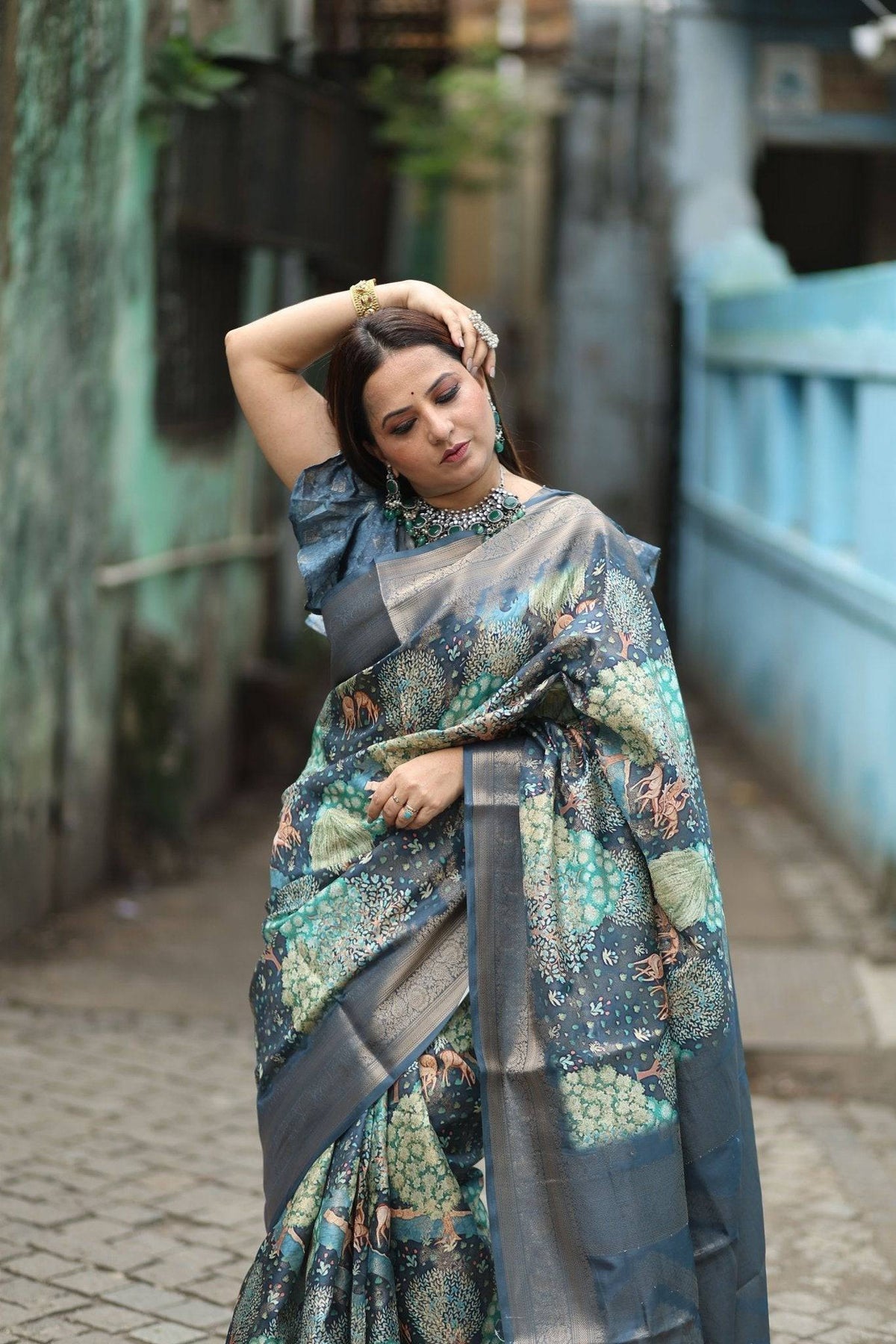 Elegant Teal Blue Banarasi Silk Saree with Forest-Inspired Motifs and