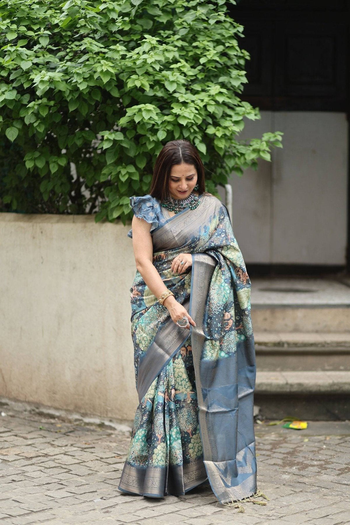 Elegant Teal Blue Banarasi Silk Saree with Forest-Inspired Motifs and