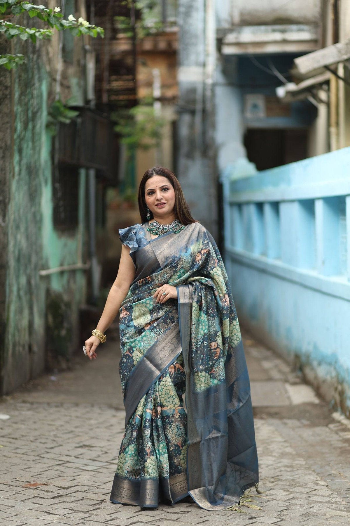 Elegant Teal Blue Banarasi Silk Saree with Forest-Inspired Motifs and