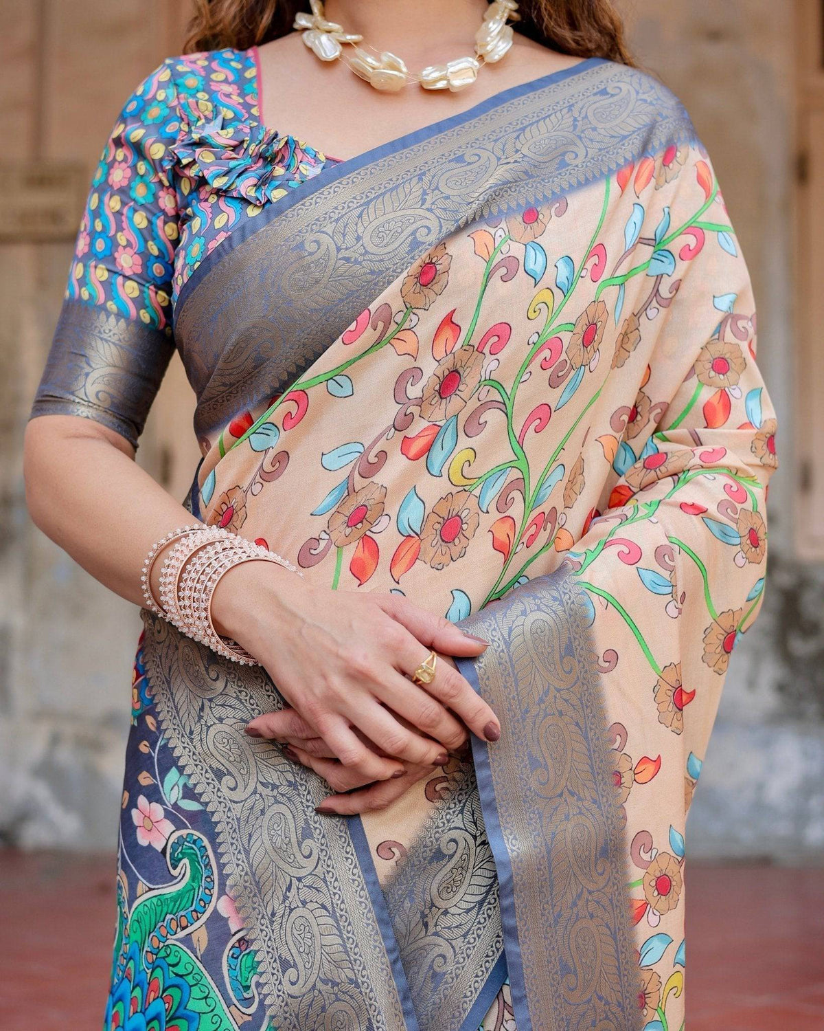 Peach and Navy Blue Floral Saree with Vibrant Peacock Pallu and Tassel