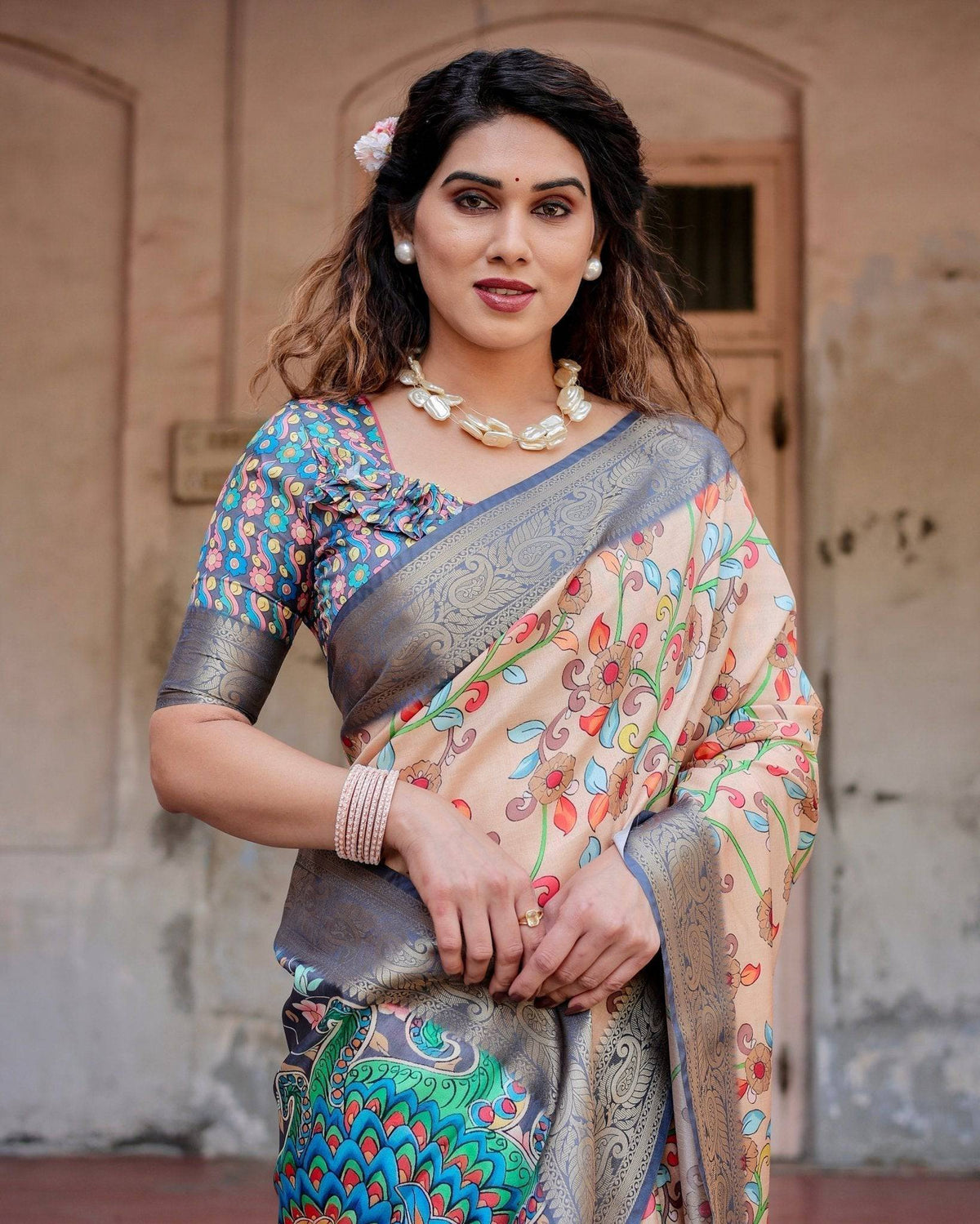 Peach and Navy Blue Floral Saree with Vibrant Peacock Pallu and Tassel