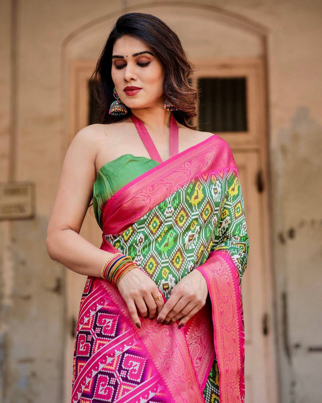 Green and Pink Tussar Silk Saree with Vibrant Ikat Patterns and Zari