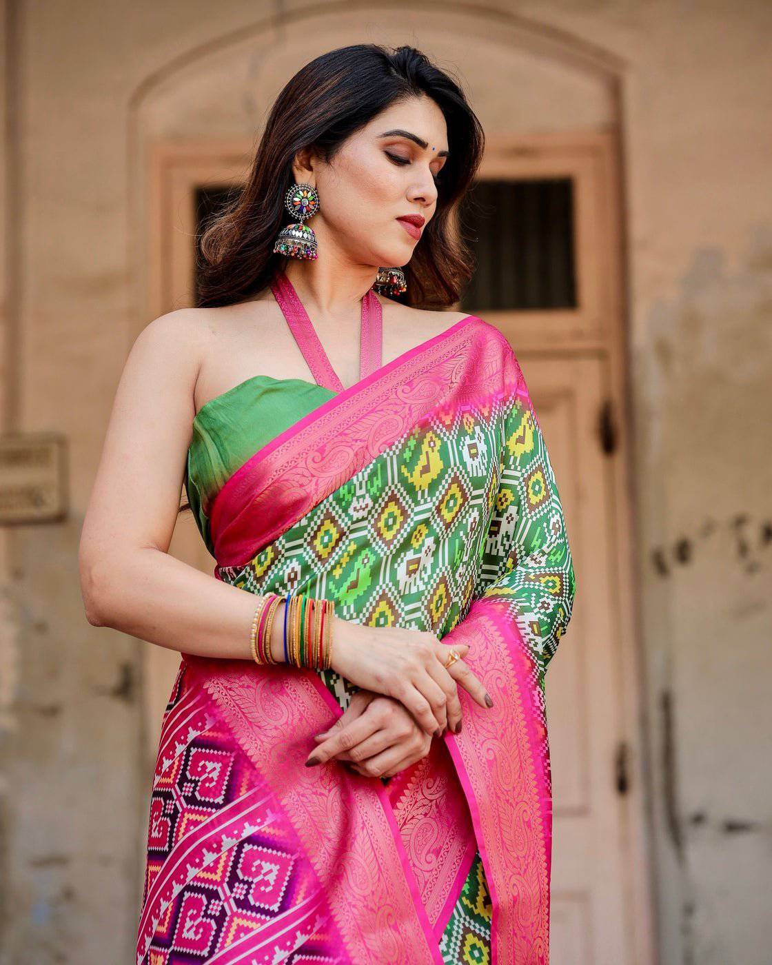 Green and Pink Tussar Silk Saree with Vibrant Ikat Patterns and Zari