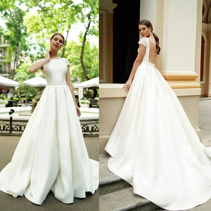 Simple Satin A-Line Wedding Dress Jewel Neck Short Capped Sleeves Backless with Ruched Sash Sweep Train Modern Beach Style