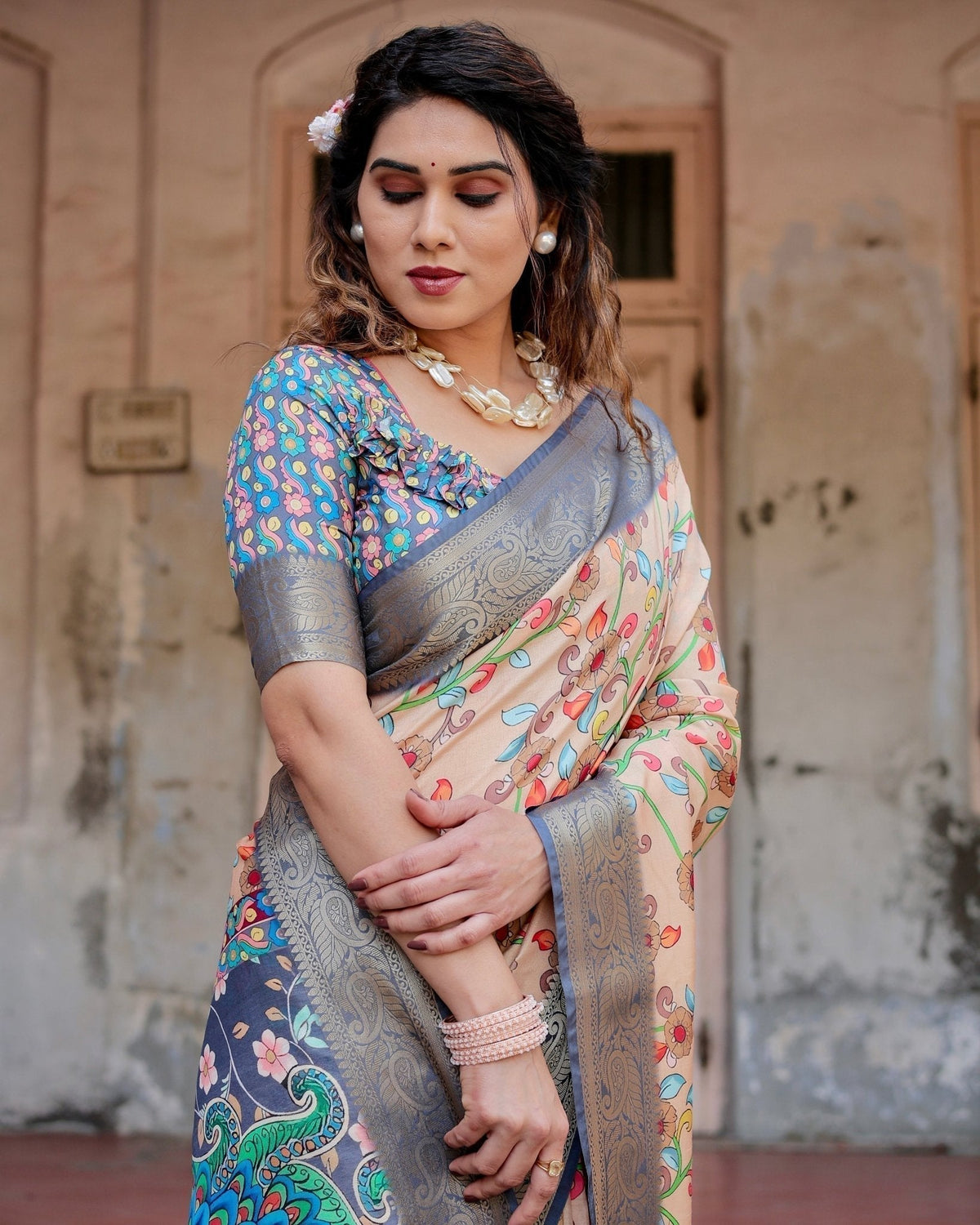 Peach and Navy Blue Floral Saree with Vibrant Peacock Pallu and Tassel