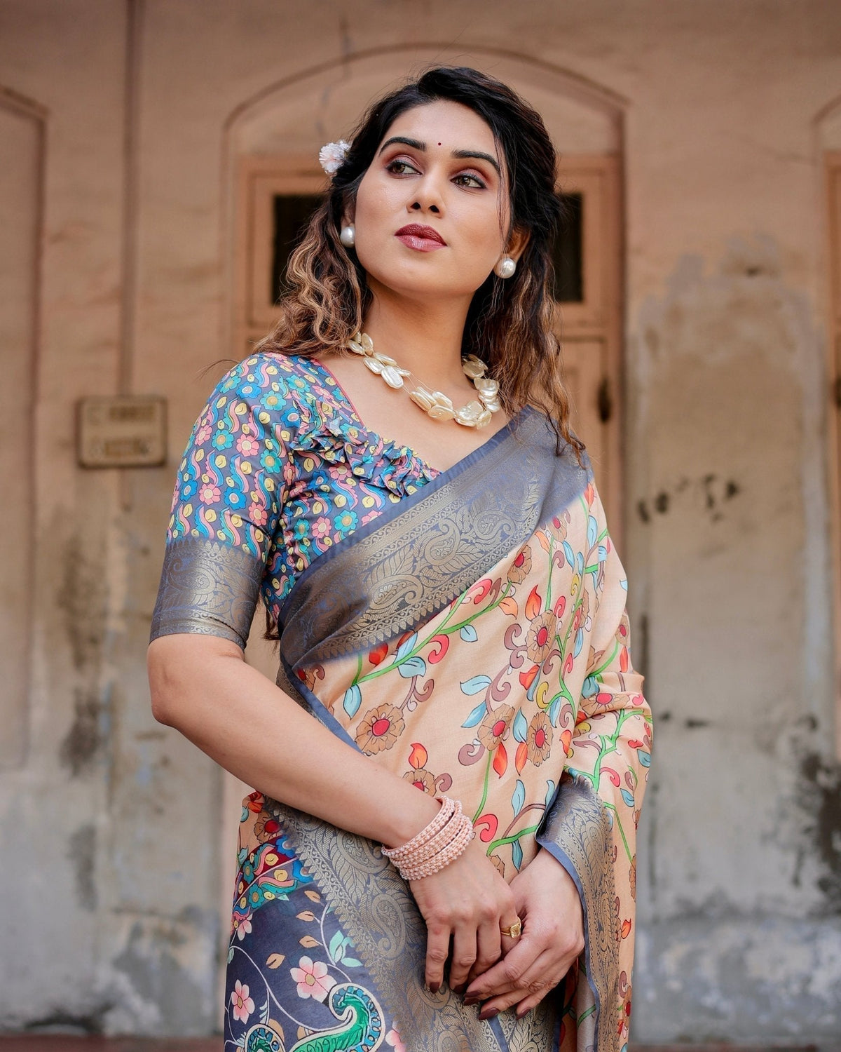 Peach and Navy Blue Floral Saree with Vibrant Peacock Pallu and Tassel