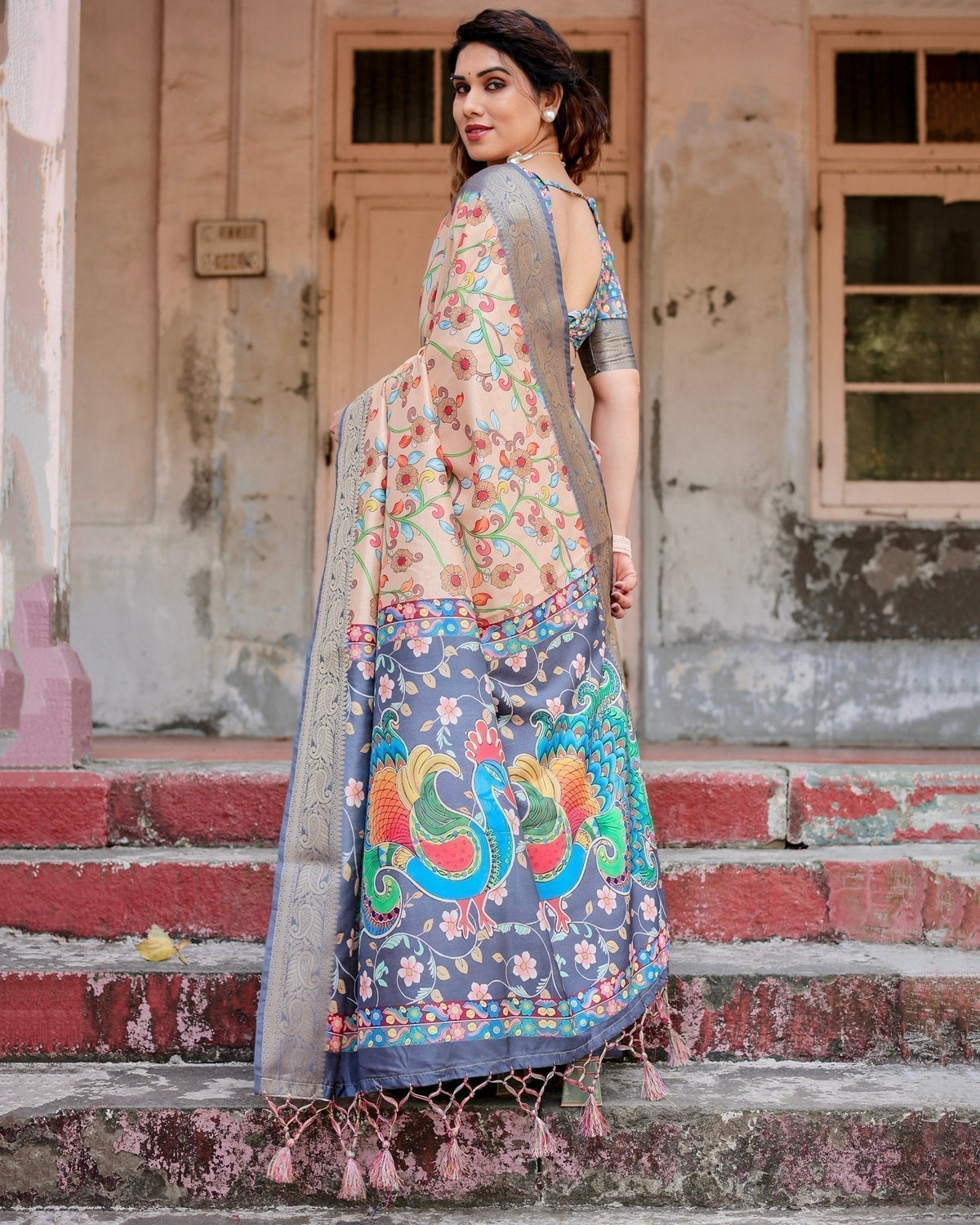 Peach and Navy Blue Floral Saree with Vibrant Peacock Pallu and Tassel