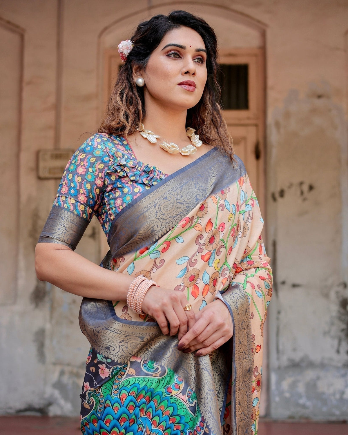 Peach and Navy Blue Floral Saree with Vibrant Peacock Pallu and Tassel